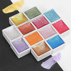 Emooqi Watercolor Paints Set, Metallic Glitter Watercolour Solid Paint Include 12 Metallic Glitter Color 2 Water Brushes 2 Color Card Storage Bag, Ideal for Illustrations Painting.